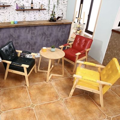 Silla confortable de diseño de madera con asiento de PU para comidas en hoteles en edificios de oficinas y cafeterías