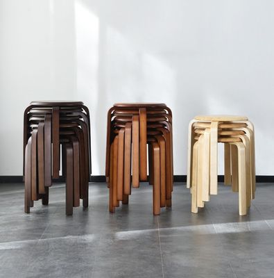 Servicio OEM Aceptado Moda taburete simple Household moderno pequeño redondo de madera sólida sillas apilables taburete de madera curva taburete de madera