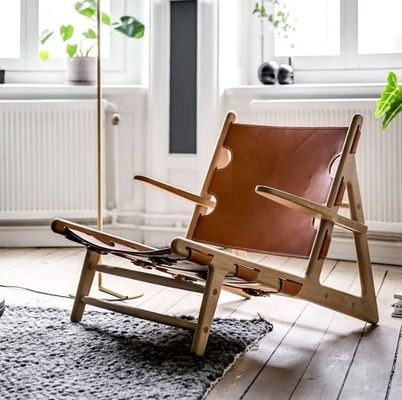 Silla de cuero de poliuretano de acabado de nitrolacquer moderno para sala de estar moderna y cómoda