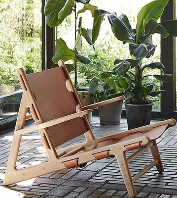 Silla de cuero de poliuretano de acabado de nitrolacquer moderno para sala de estar moderna y cómoda