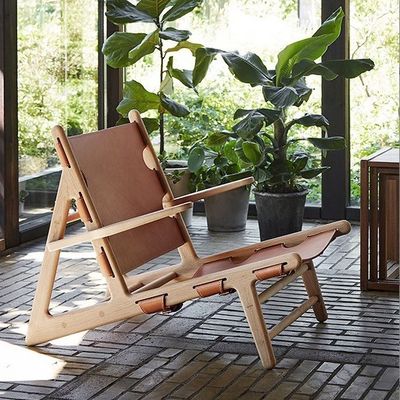 Silla de cuero de poliuretano de acabado de nitrolacquer moderno para sala de estar moderna y cómoda
