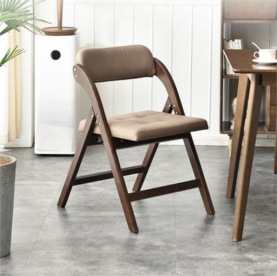 Silla plegable de madera sólida tapizada de cuero PU para restaurante hotel en estilo moderno nórdico